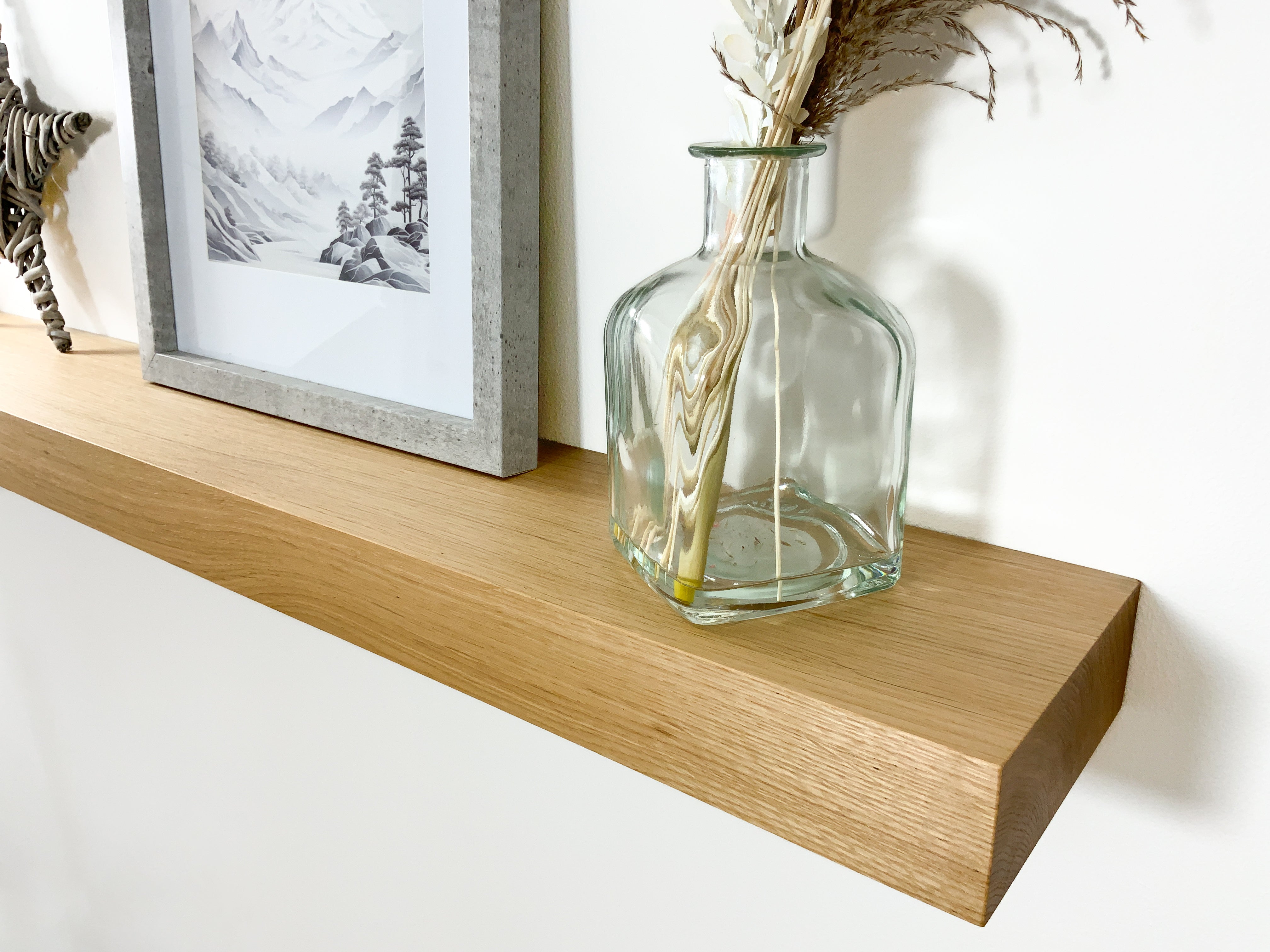 Chunky modern softened edge oak floating shelf side close up