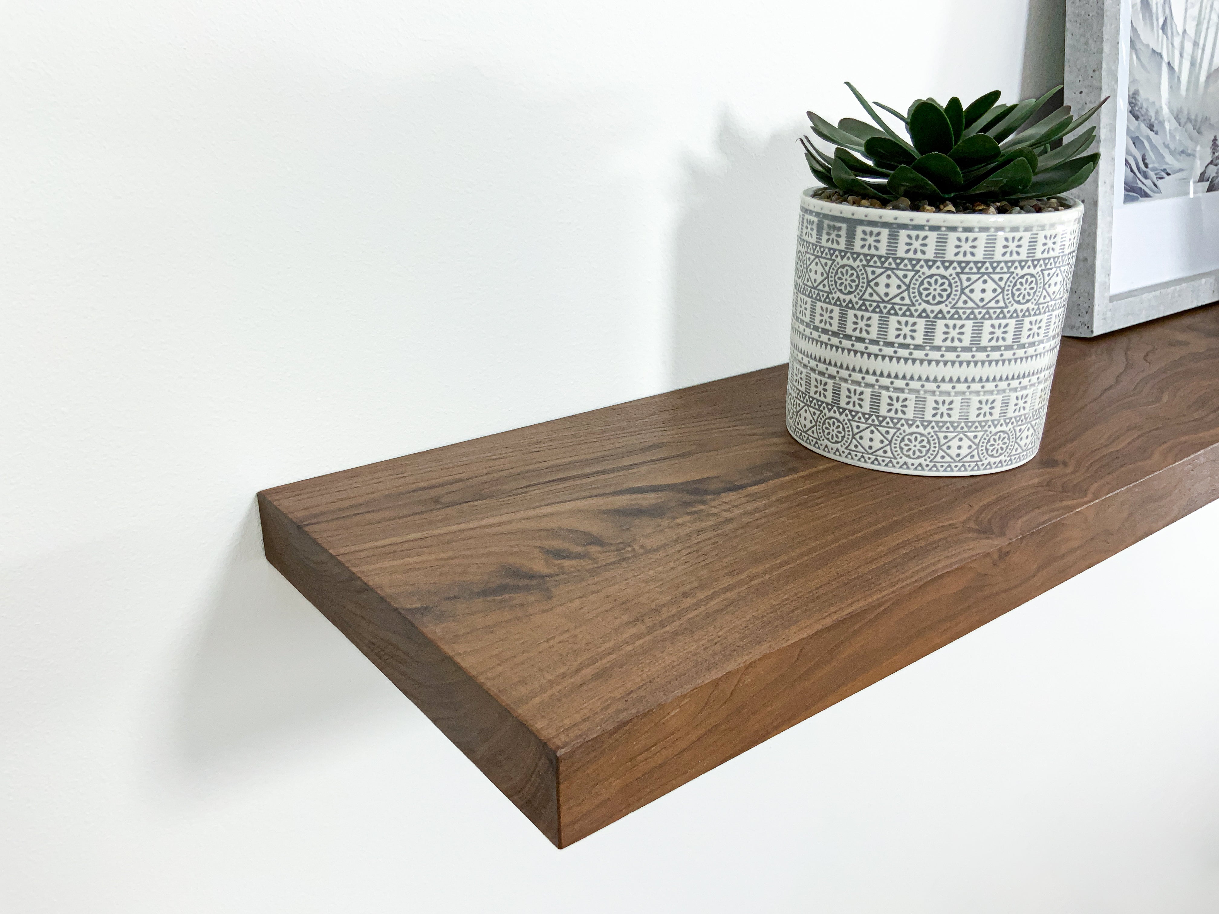 Thick modern walnut shelf close up side